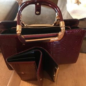 Red leather handbag with matching wallet